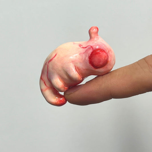 Handcrafted Creepy Cute Alien Embryo Monster Statue - A Striking Bloody Embryo Sculpture